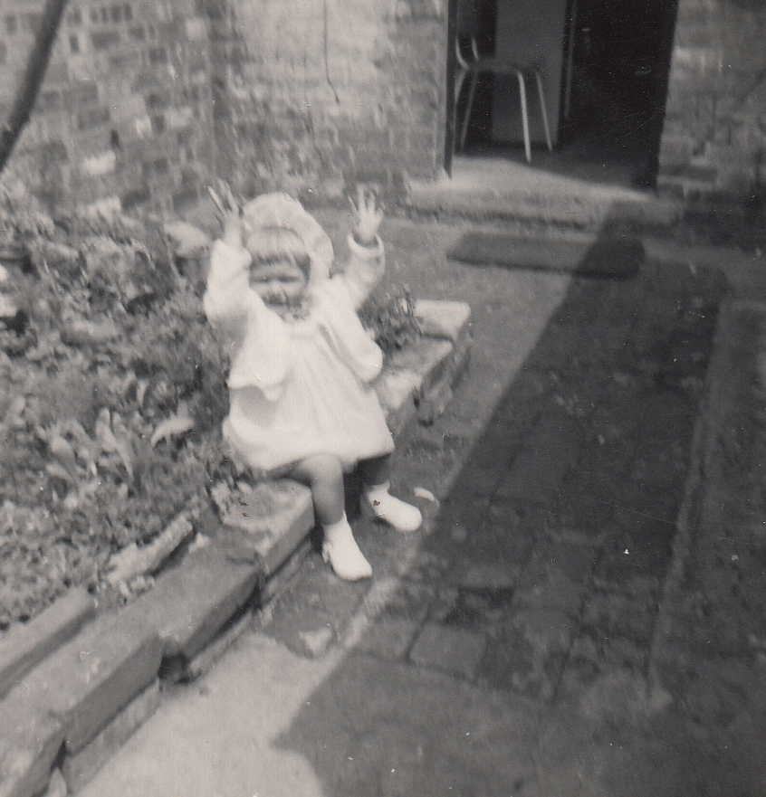 One of my daughters in the yard at Railway Terrace
