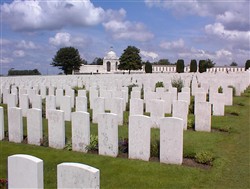 Colour photograph showing several rows of headstones.