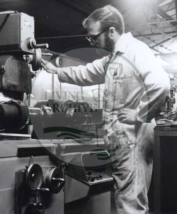Michael Brace working on a grinding machine at Filtrona in the mid 1960s. Photograph supplied by kind permission of BCHI (Accession Ref: BLE/P/).Original donated by Living Archive.