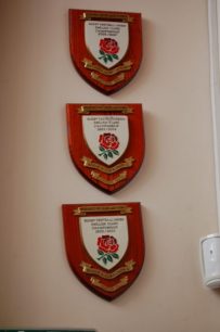 Three shields displayed at Bletchley RUFC Clubhouse