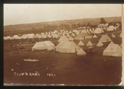 Slide of an army camp and guns.