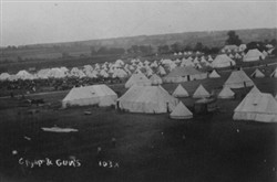 Slide of an army camp and guns.