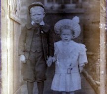 photograph of a small boy and girl