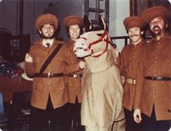 Photograph of four men dressed as soldiers and a costume horse.