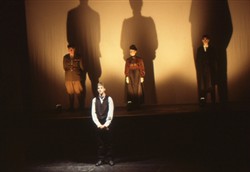 Slide of a woman, officer and man on the stage