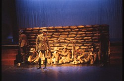 Slide of soldiers sheltering behind a wall