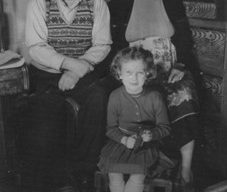 Photograph of elderly couple with a young girl