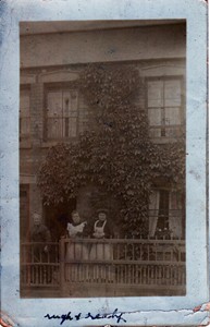 Photographic postcard "Family in Front of House"