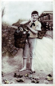 Photographic postcard "Boy with flower baskets"