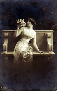 Photographic postcard "Lady on bench"