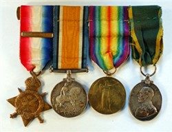 Four medals mounted on a bar