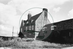 Photograph of Bradwell Abbey farmhouse and outbuildings (1971).