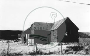 Photograph of farm buildings at Woolstone (1971).