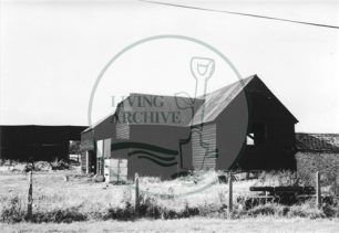 Photograph of farm buildings at Woolstone (1971).