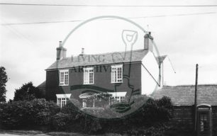 Photograph of farmhouse in Woolstone (1971).