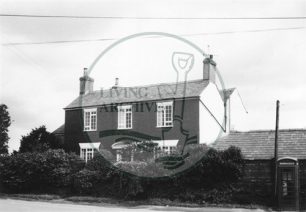 Photograph of farmhouse in Woolstone (1971).