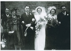 Frank Brown and Beryl Taylor on their wedding day with family.