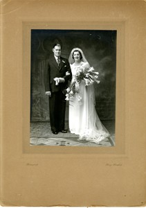 Official wedding photograph of Frank Brown and Beryl Taylor in a studio.