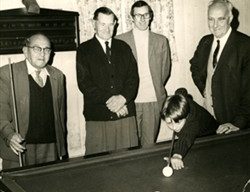 Photograph of billiards players.