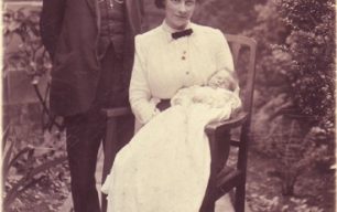 A vicar with his wife and baby.