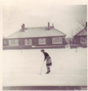 Beryl Brown clearing snow.
