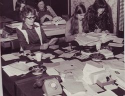 Women getting postal votes organised.