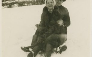 Beryl Taylor and Frank Brown on a sledge.