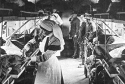 Interior of ambulance train with medical staff and patients