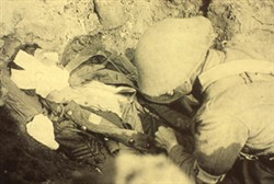 Slide of a photograph of a soldier treating another one