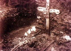 Slide of a photograph of a grave.