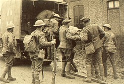 Slide of a photograph of soldiers loading a stretcher onto an ambulance
