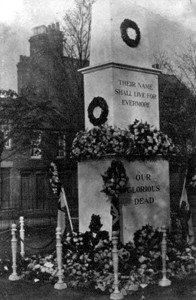 War memorial decorated with flowers