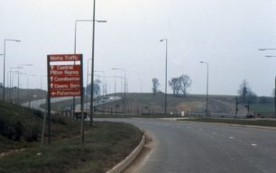 A carriageway with works directional sign
