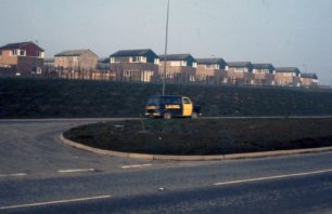 A housing estate and LAING minibus