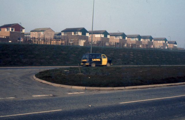 A housing estate and LAING minibus
