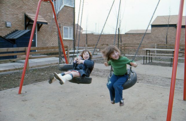 Two little girls on swings in Eaglestone
