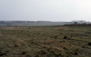 View of the city centre over an undeveloped field