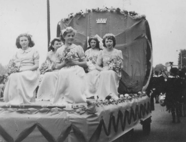 Carnival Queen & attendants on float.