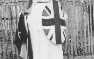 A woman dressed up as Britannia (with trident, helmet and union jack shield)
