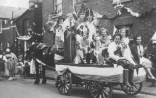 Connie at George V  Jubilee - 1st Bradwell guides on a horse-drawn cart in a decorated street.
