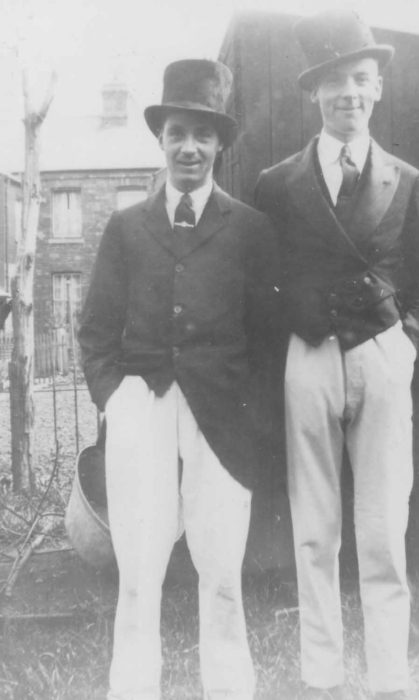 Two gentlemen in top hats and tails