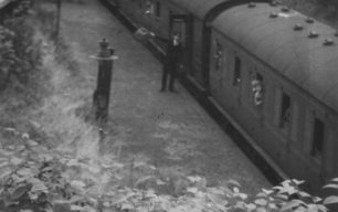The Guard waves off the Last Train at Bradwell Station