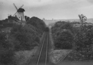 The Last Train at New Bradwell, going past the windmill, 5-Sep-1964