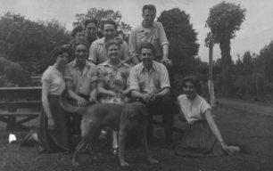 Group of adults with a dog.