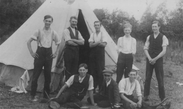 Eight men with a tent. On right Perce Eldred.