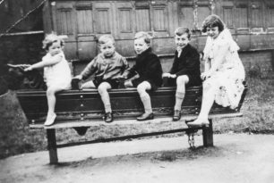 Children on long rocking horse in playground