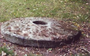Millstone, resting on the ground
