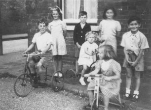 Children and tricycles at Corner Pin, New Bradwell