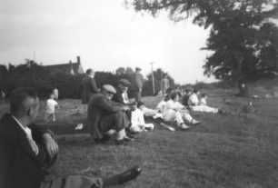 Watching a cricket match from the bank on the  field c1951.