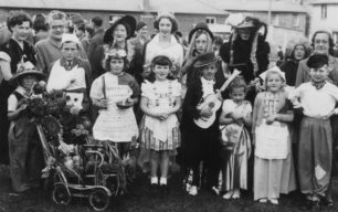 May Queen Joy Atkinson with fancy dress competitors.